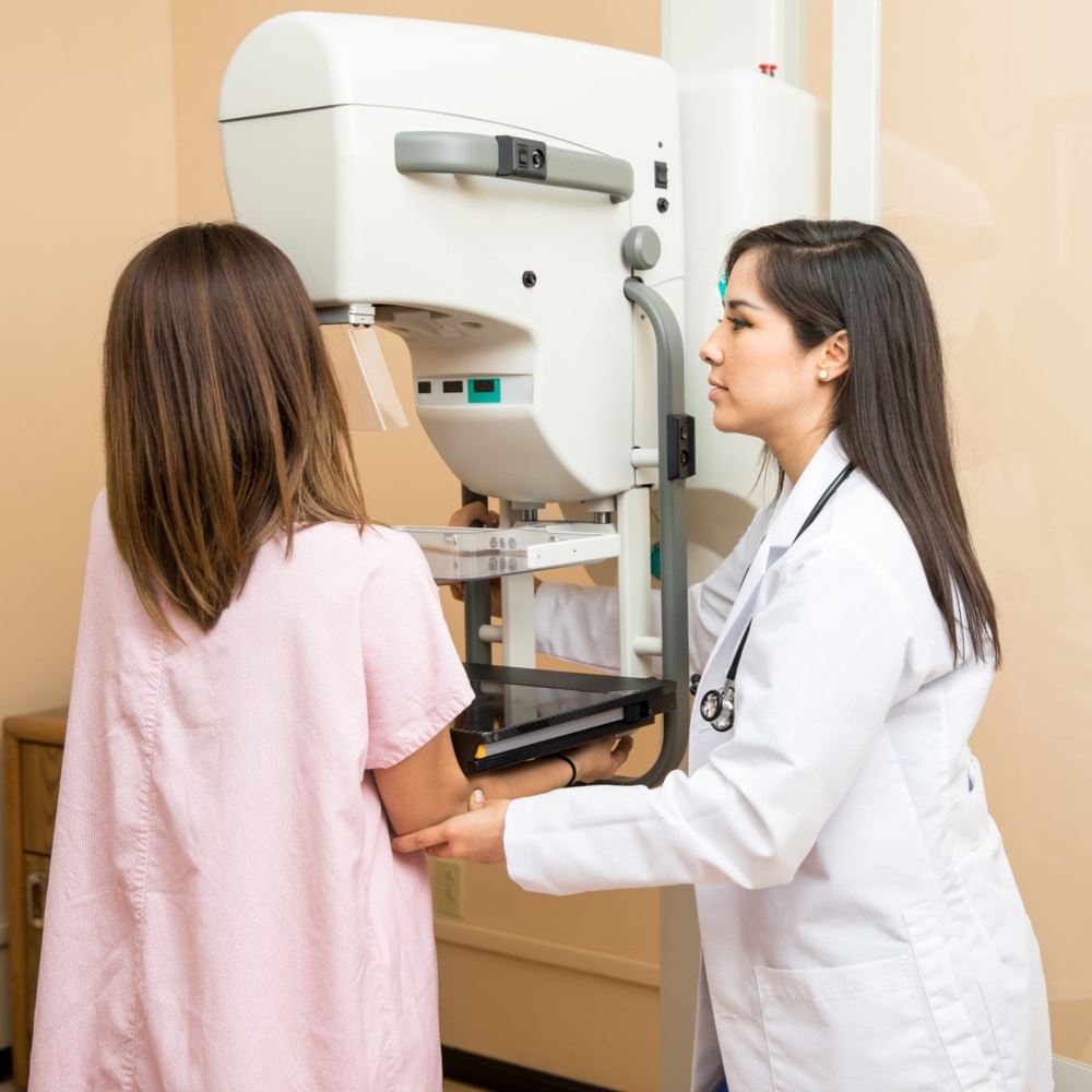 Mammography tech administering exam