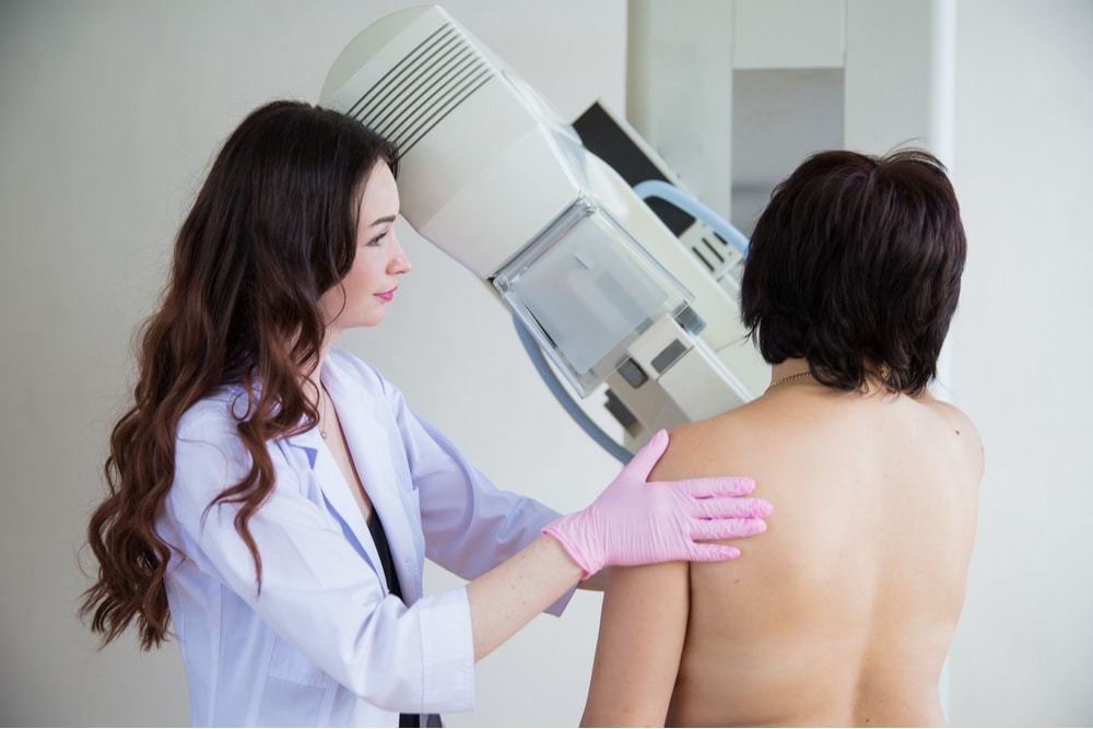 Mammography tech administering exam