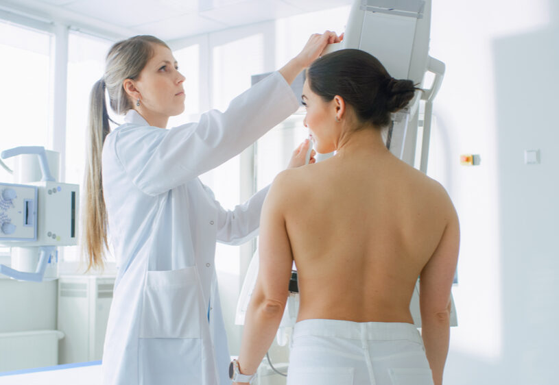 Mammography tech administering exam