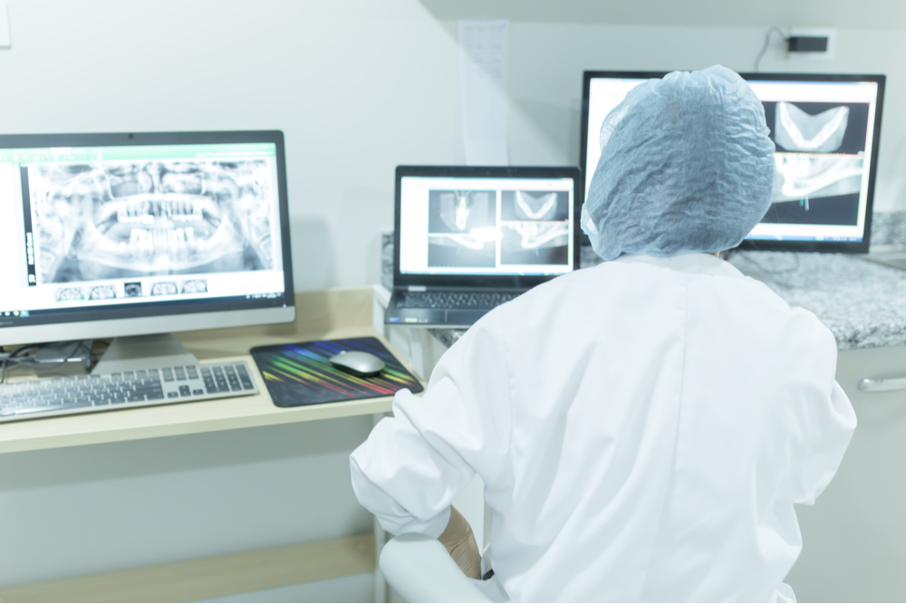 Radiologist looking at images on computer