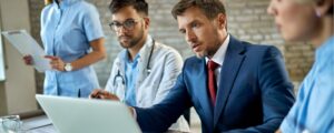 Hospital executives and doctors discussing finances